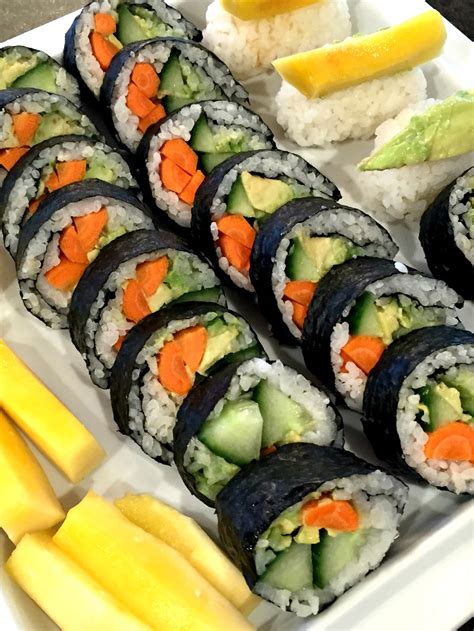 Veggie sushi rolls - Cucumber sushi is an easy recipe to put together with friends and family. It's easily adaptable to any diet or taste preferences, and a fun twist on sushi. | Cucumber Rolls | American Sushi | Kid Activities | Kid Friendly | Easy Recipes #cucumbersushi #cucumbers #summerrecipes #kidfriendly #seafood #feelgoodfoodie